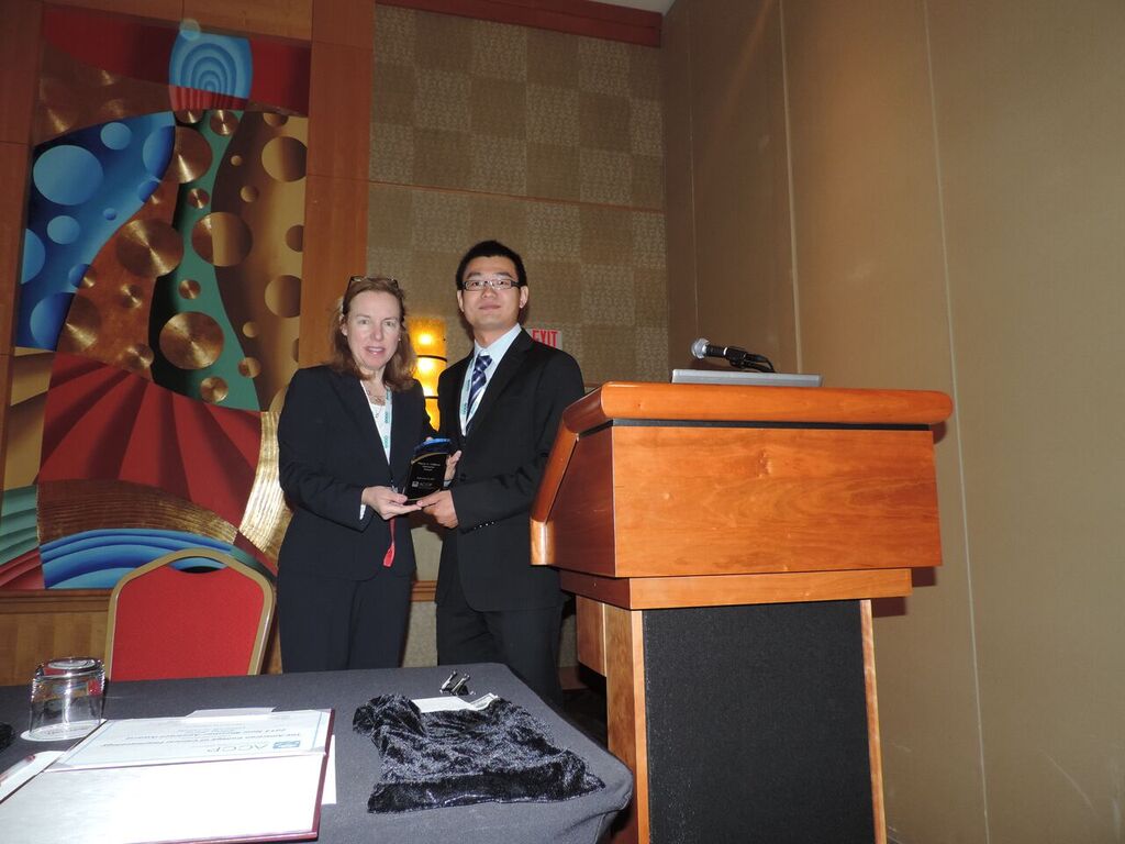  Dr. Xiaofeng Wang receives the  Wayne A Colburn Memorial Award  from Dr. von Moltke 