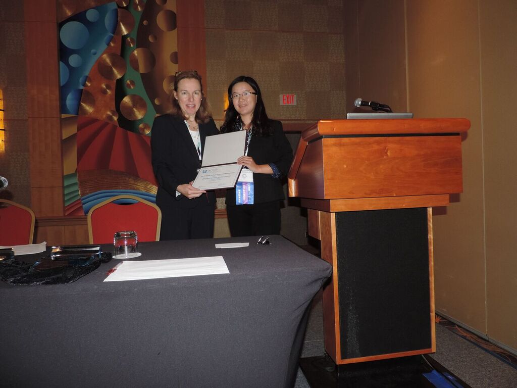 Dr. Xiling Jiang receives the New Member Abstract Award from Dr. von Moltke  