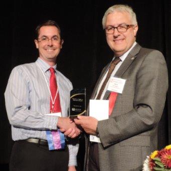 Dr. Jonathan Constance receives the Wayne A. Colburn Memorial Award from Dr. Meibohm